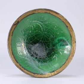 A Song Dynasty Ding kiln green glaze carved flower plate