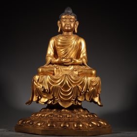 A finely gilt seated statue of Shakyamuni