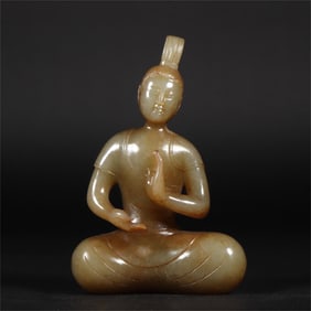 A beautiful seated statue of a medieval jade Buddha