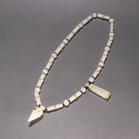A gold necklace of Hetian jade seed material of Liaojin