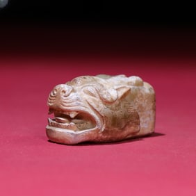 A Western Zhou gray skin microcalcified tiger head inlay