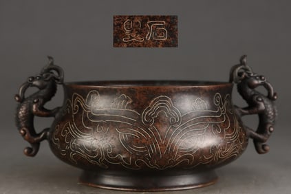 A Ming Dynasty precisely cast purple copper tire wrong silver wire gluttonous pattern dragon ear
