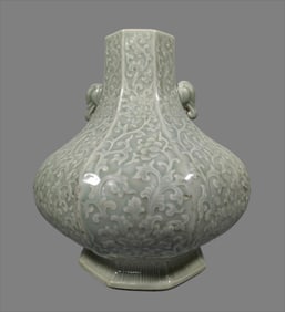 A sky blue glazed bottle with hexagonal elephant ears from the Qing Dynasty