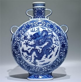 A Qing Dynasty Qianlong blue and white dragon four-eared moon vase