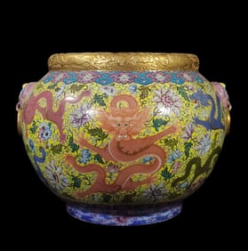 A yellow ground nine dragon carved dragon mouth with gold lion ear jar made in the Qianlong period