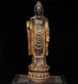 A statue of Amitabha Buddha in bronze rubbing