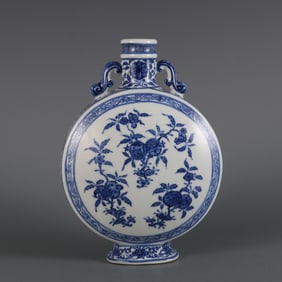 A blue and white broken branch flower fruit pattern ruyi ear flat bottle made in the Qianlong era of