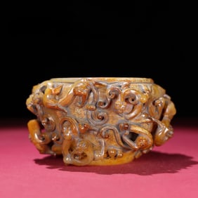 A Warring Han Hetian jade full of high-relief dragon jars