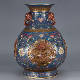 A Qing Dynasty Qianlong's window-opening four-dragon extruded copper tire enamel elephant ear bottle
