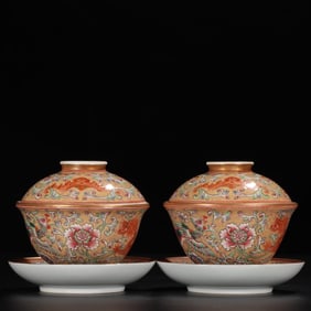 A pair of pastel gold-painted entwined lotus flowers made in the Qianlong period of the Qing