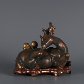 A bronze glaze gold-sprinkled longevity deer ornament made in the Qianlong period of the Qing