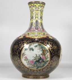 A flower and bird appreciation vase made in the Qing Dynasty with enamel blue glaze and gilded