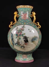 A Qing Dynasty Qianlong era enamel green space window crane flat bottle