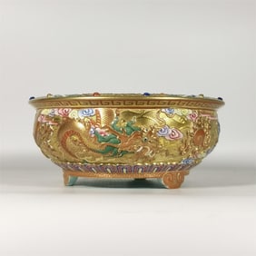 A Qing Dynasty Qianlong era enamel colored gold ground carved double dragon bead incense burner