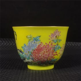 A Qing Dynasty Qianlong enamel yellow glazed flower master cup
