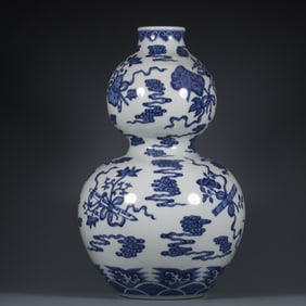 A blue and white auspicious cloud dark eight immortal pattern gourd bottle made in the Yongzheng