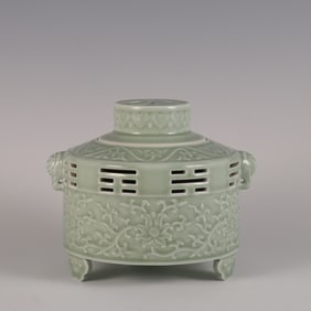 A bean celadon carved entwined lotus hollow Tai Chi aroma stove made in the Qianlong period of the