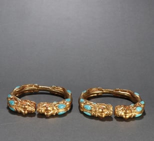 A pair of copper-gilt inlaid turquoise dragon pattern bracelets from the Tang Dynasty