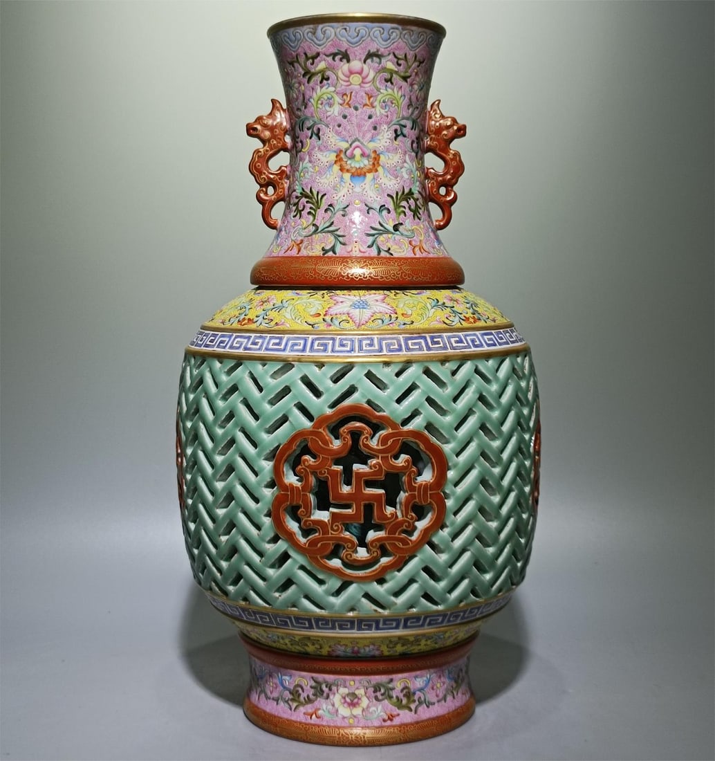 A Qing Dynasty Qianlong model of enamel colored phoenix tail grass bean celadon glaze hollow: Qing Qianlong style enamel color phoenix tail grass bean celadon glaze hollow longevity boundless amphora heart vase Size:H:39.6cm W:20cm (The Dimensions Of All Batches Are Manually Measured.If You Ne