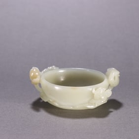 A Hetian jade flower and bird cup from the Ming Dynasty