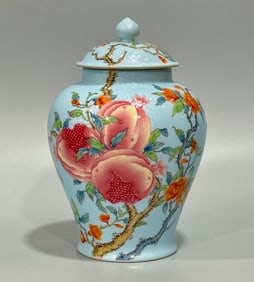A small general jar with a pomegranate pattern on the enamel blue ground track made in the Qing