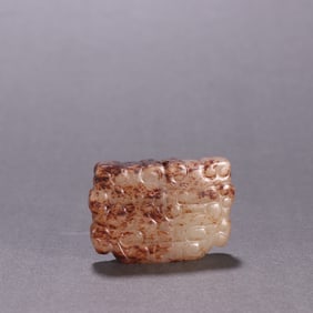 A jade ornament with a beast face pattern in the Han Dynasty