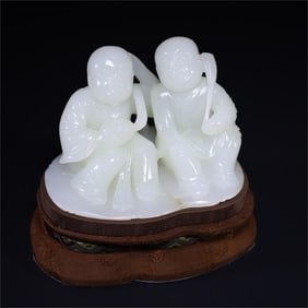 A Qing Dynasty Hetian jade and two immortal ornaments