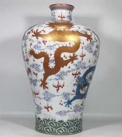 A Qing Dynasty Qianlong enamel colored five-dragon wearing cloud plum bottle