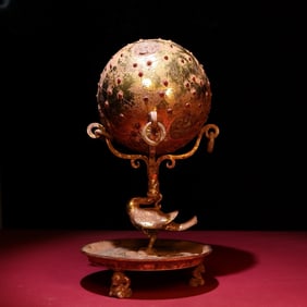 A piece of copper gilt gold inlaid jade gemstone globe