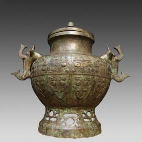 A fine bronze inscription elephant ear round jar
