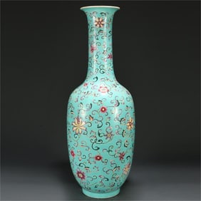 A Qing Dynasty enamel entwined flower longneck vase