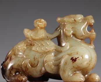 A beautiful Hetian jade Hu man riding a beast