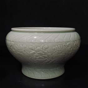 A bean celadon carved entwined lotus incense burner made in the Kangxi period of the Qing Dynasty