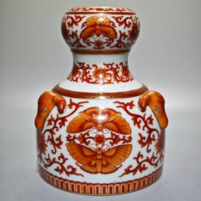 A Qing Dynasty Qianlong year alum red gold-painted entwined lotus butterfly pattern three sheep open