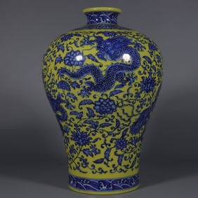 A blue and white entwined lotus burnt yellow dragon pattern plum bottle made in the Qianlong period