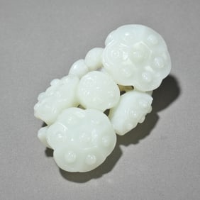 A Ming and Qing dynasty Hetian jade seed material lotus pod handle