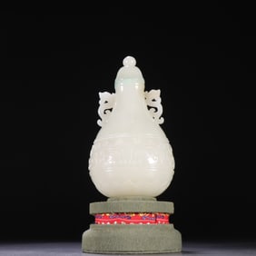 A Qing Dynasty Hetian jade gluttonous pattern dragon ear bottle