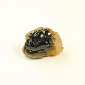 A two-color tourmaline carving Sanyang Kaitai pendant from the Qing Dynasty