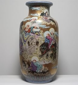 A Qing Dynasty Qianlong pastel gold ground eighteen Arhat winter melon bottle