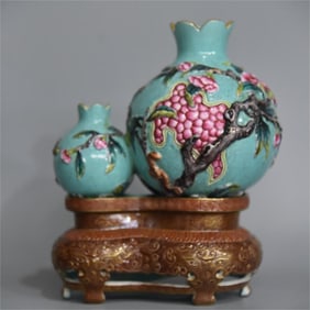 A beautifully carved bionic porcelain enamel pomegranate bottle