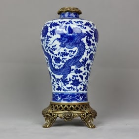 A beautiful blue and white dragon pattern inlaid with copper-rimmed plum vase