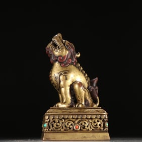 A fine copper gilt beast button seal