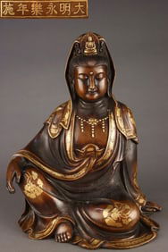 A Ming Dynasty purple copper tire gilded Guanyin seated statue