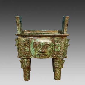 A beautiful bronze human face square tripod inscription