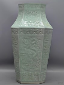 A bean celadon carved dragon and phoenix to present auspiciousness Bafang bottle