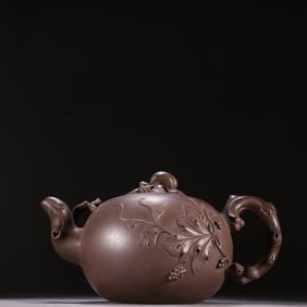 A purple sand squirrel grape teapot in the style of Zhu Kexin