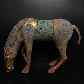A bronze gilt painted drinking horse from the Warring Han Dynasty