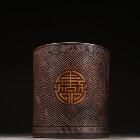 A Qing Dynasty rosewood pinched silver silk pen holder