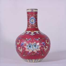 A pastel carmine red rolled road entwined lotus celestial ball made in the Qianlong period of the