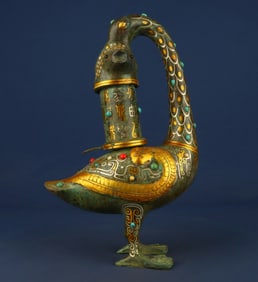 A bronze gold and silver inlaid multi-gemstone goose fish lamp from the Han Dynasty